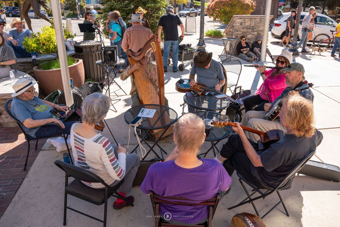 Outdoor street musicians performing a jam session at Auburn Porchfest